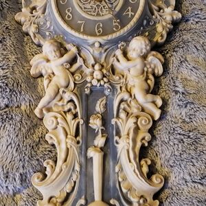 Vintage-Inspired Cream Wall Clock with Cherub Accents